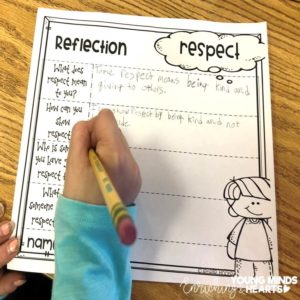 A picture of a student who is doing a written reflection about respect
